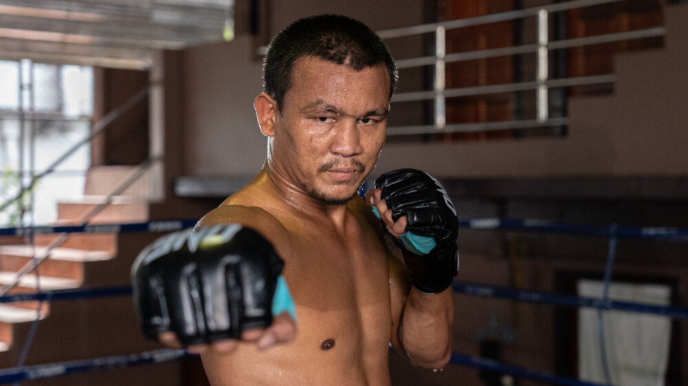 Seksan Or Kwanmuang poses for a picture during training camp in Bangkok