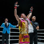 Rambolek Chor Ajalaboon raises his hands in jubilation after defeating Abdulla Dayakaev at ONE Fight Night 39