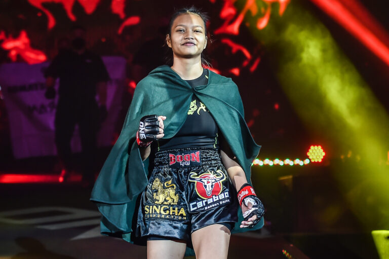 Supergirl walks toward the ring for her fight with Ekaterina Vandaryeva at ONE: HEAVY HITTERS