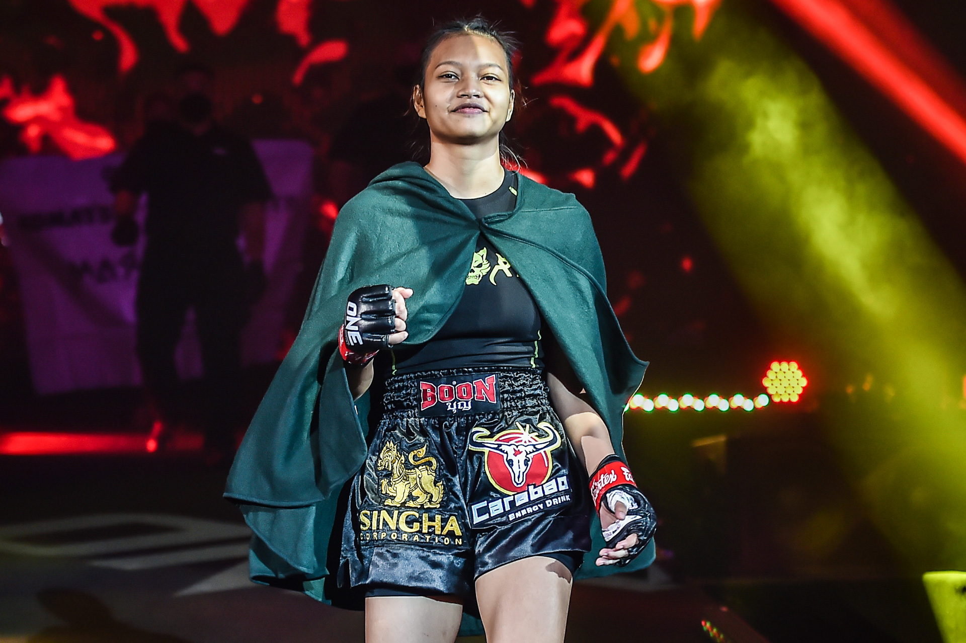 Supergirl walks toward the ring for her fight with Ekaterina Vandaryeva at ONE: HEAVY HITTERS